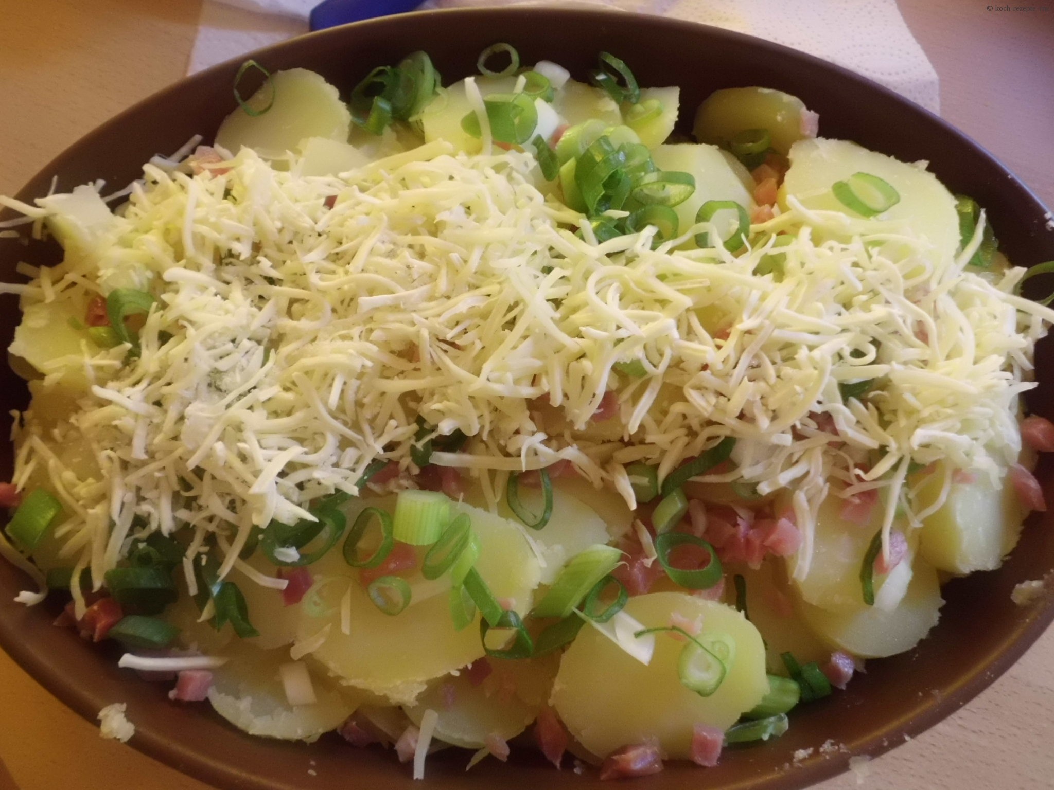 Rezept Kartoffelauflauf schnell aus Pellkartoffeln mit Speck backen